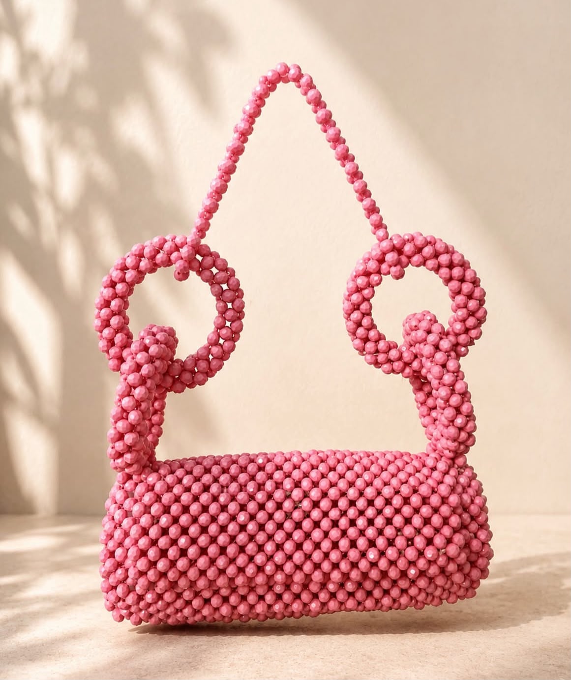 Bubblegum Audi — Pink beaded bag with looped handles